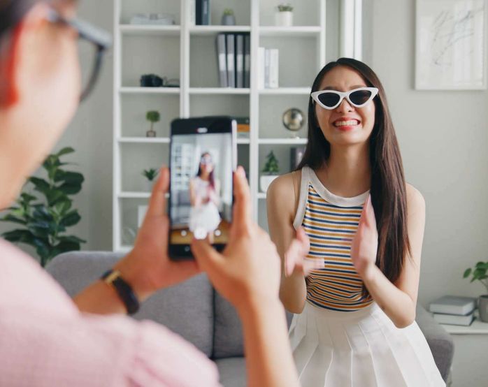 Woman taking picture 2x